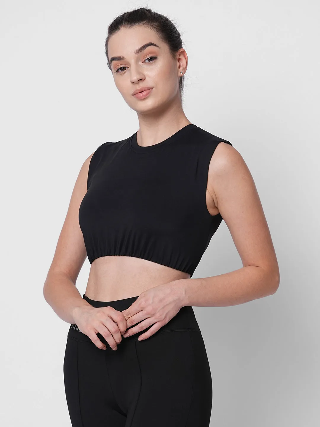 Fitkin women black solid short sleeve crop top with back design