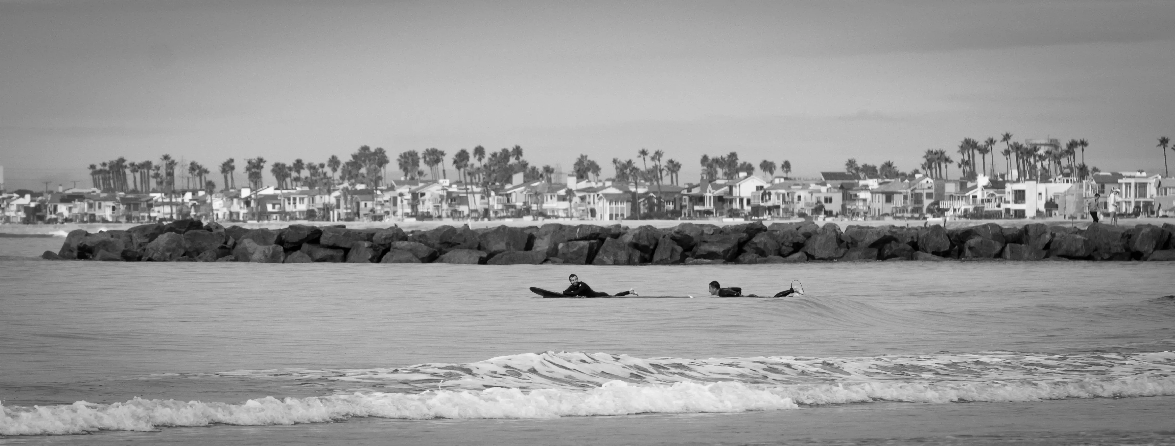 Waves and Wonders: Surfers and Cityscape of Newport Beach