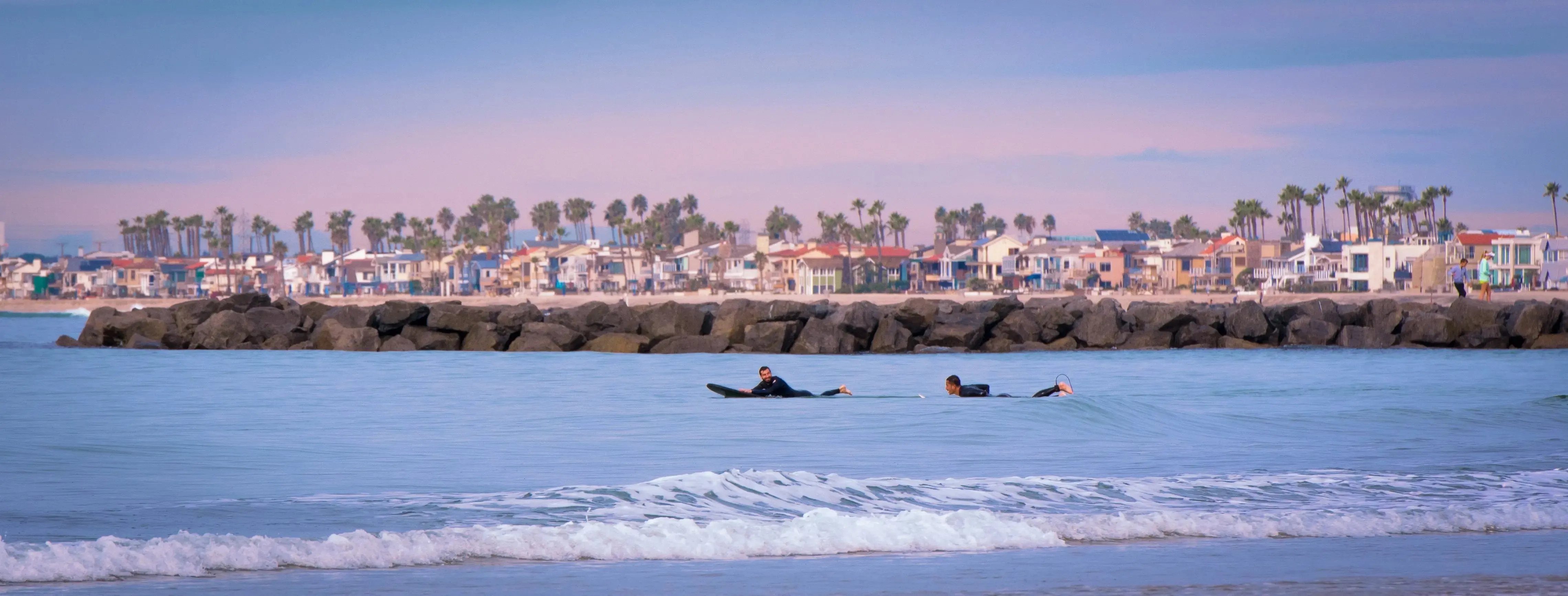Waves and Wonders: Surfers and Cityscape of Newport Beach
